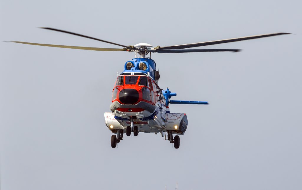 helicopter flying over the sea